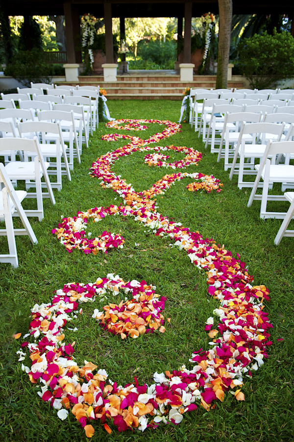 Outdoor wedding ceremony aisle with a design of pink, orange and white petals - photo by top Atlanta-based wedding photographer Scott Hopkins Photography
